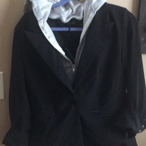 Black coat with gray hooded sweatshirt